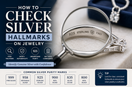 Person examining silver jewelry hallmark with magnifying glass to verify sterling silver authenticity and purity stamp
