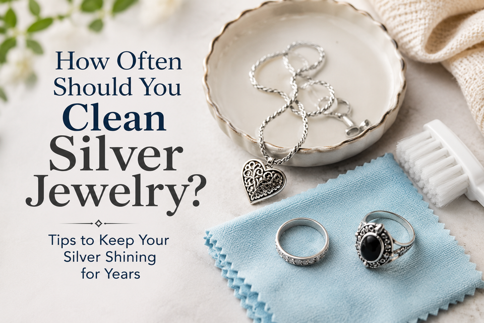 Silver jewelry cleaning guide with rings, necklace, polishing cloth, and cleaning tools arranged on a bright surface.