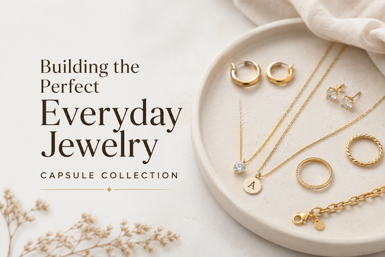 Minimalist gold jewelry collection on a cream background with text: Building the Perfect Everyday Jewelry.