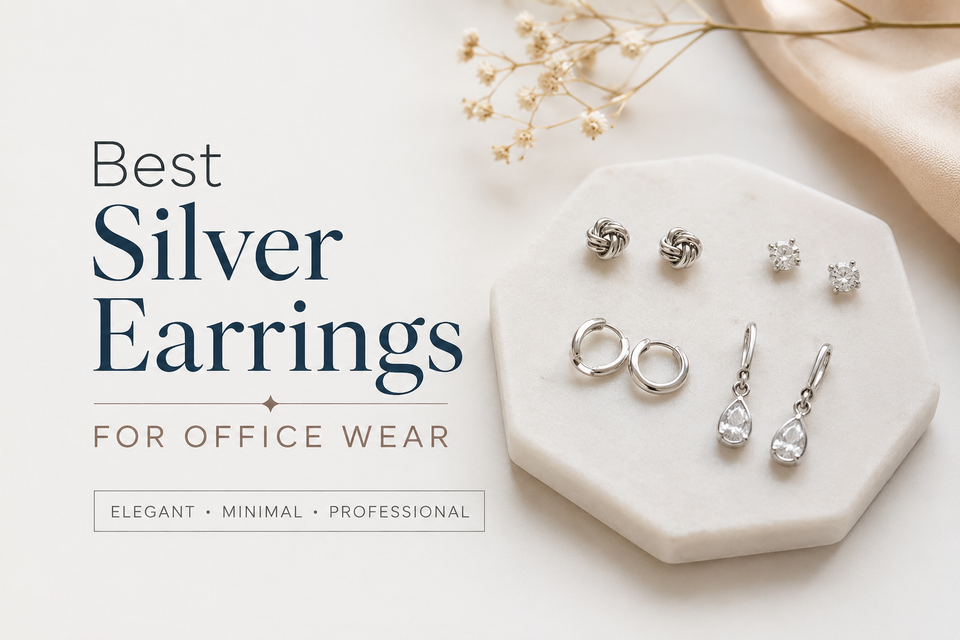 Collection of minimalist silver stud, hoop, and geometric earrings displayed on an office-ready jewelry tray