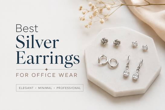 Collection of minimalist silver stud, hoop, and geometric earrings displayed on an office-ready jewelry tray