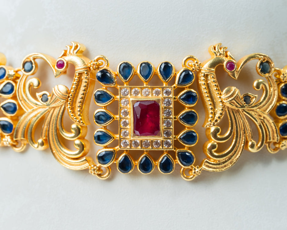 Gold-Plated Peacock Choker Necklace with Ruby & Blue Stone Work