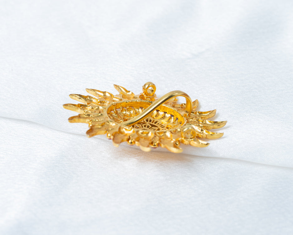 Gold-Plated Sunburst Temple Pendant with Ruby & White Stones