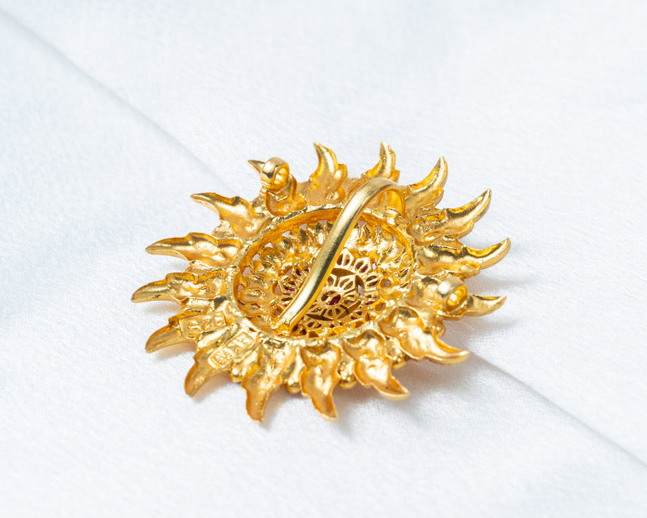 Gold-Plated Sunburst Temple Pendant with Ruby & White Stones
