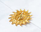 Gold-Plated Sunburst Temple Pendant with Ruby & White Stones