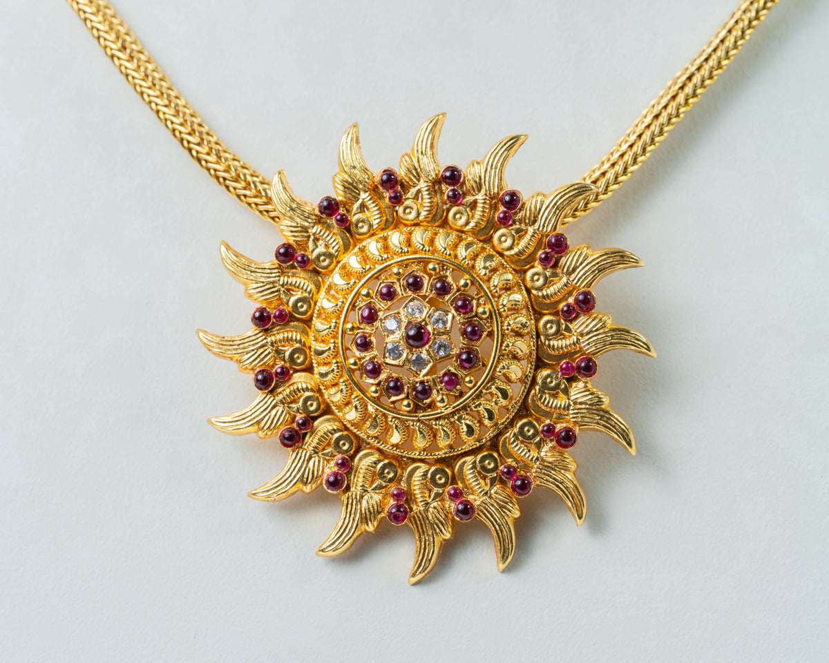 Gold-Plated Sunburst Temple Pendant with Ruby & White Stones
