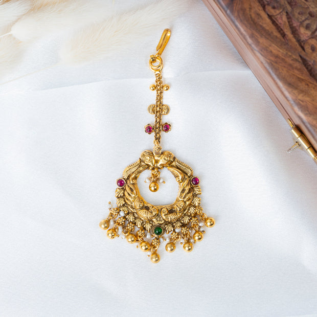 Traditional Gold-Plated Peacock Nakshi Maang Tikka with Ruby & Green Stones
