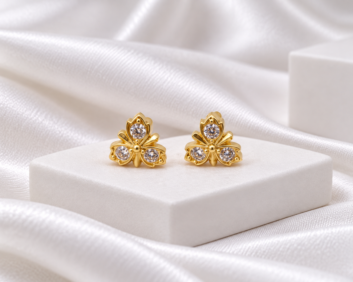 Gold Tone Three-Petal Floral Stud Earrings with Clear Stones