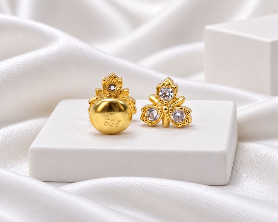 Gold Tone Three-Petal Floral Stud Earrings with Clear Stones