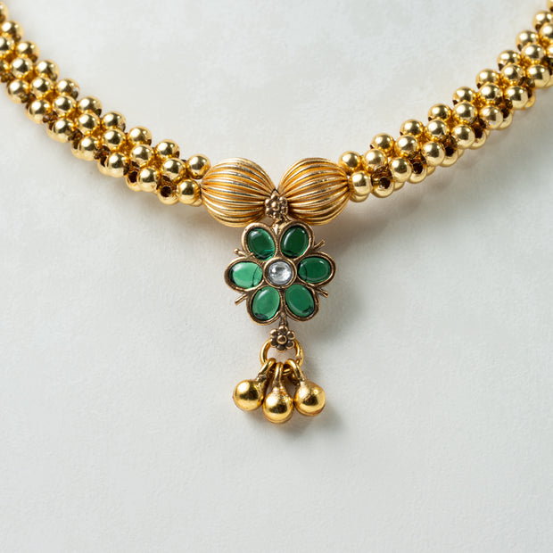 Traditional Gold-Tone Beaded Necklace with Green Floral Pendant